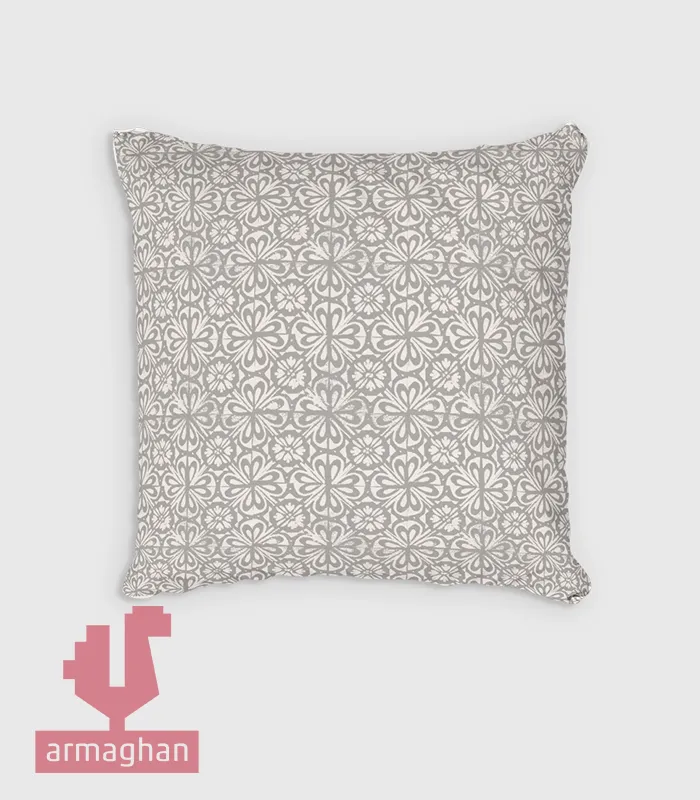 Light gray patterned cushion with repeating pattern