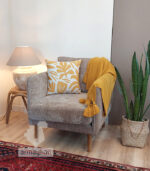 Buy a mustard patterned cushion with a leaf pattern