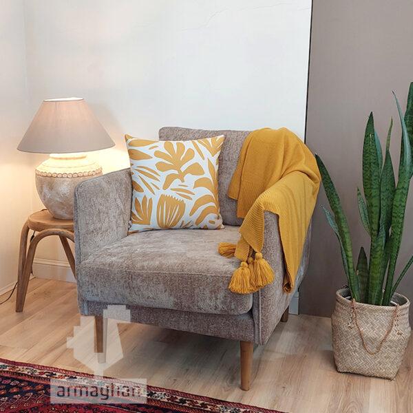 Buy a mustard patterned cushion with a leaf pattern