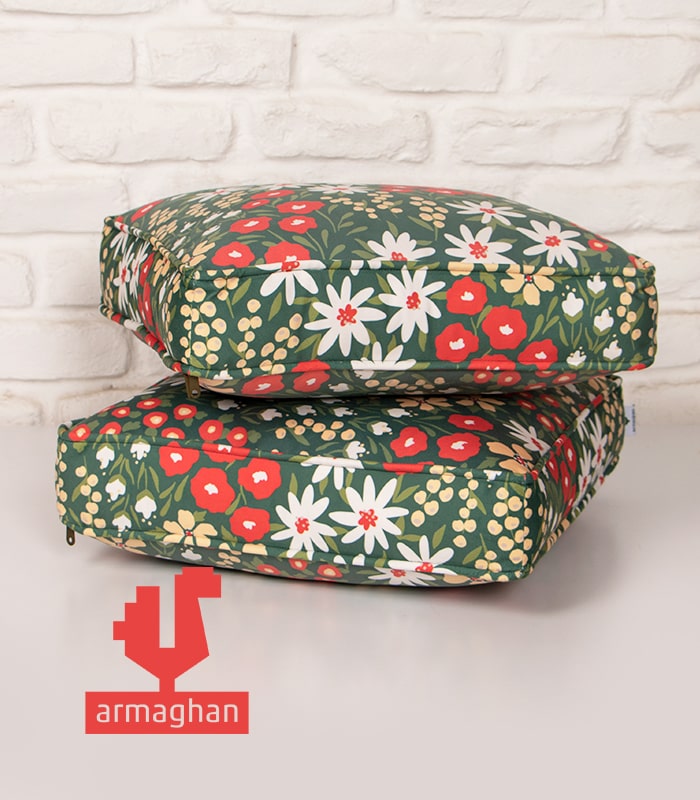 Green-cube-seating-pillow-with-modern-white-and-orange-flowers