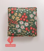 Green-cube-seating pillow-with-white-flowers